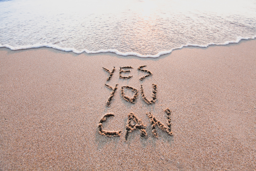 yes you can, motivational inspirational message on sand